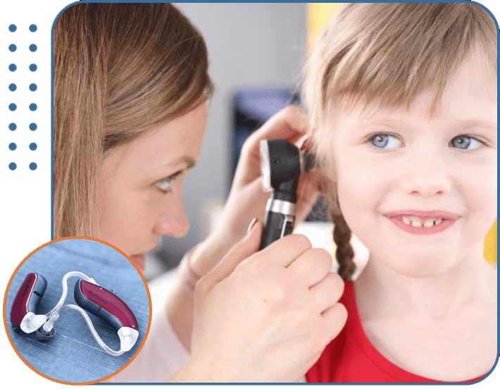 A South Shore Hearing Center audiologist inspecting a young girl's ear